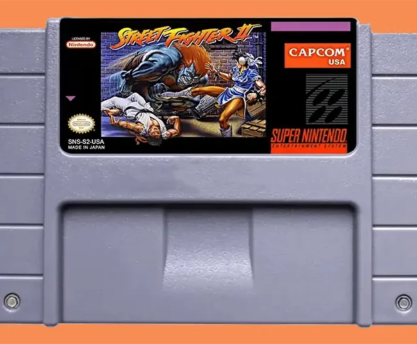 Cartucho Street Fighter 2 original da Nintendo, jogo clássico de luta, no label blanka enfrentando Chun-li e Ryu caido no chão.